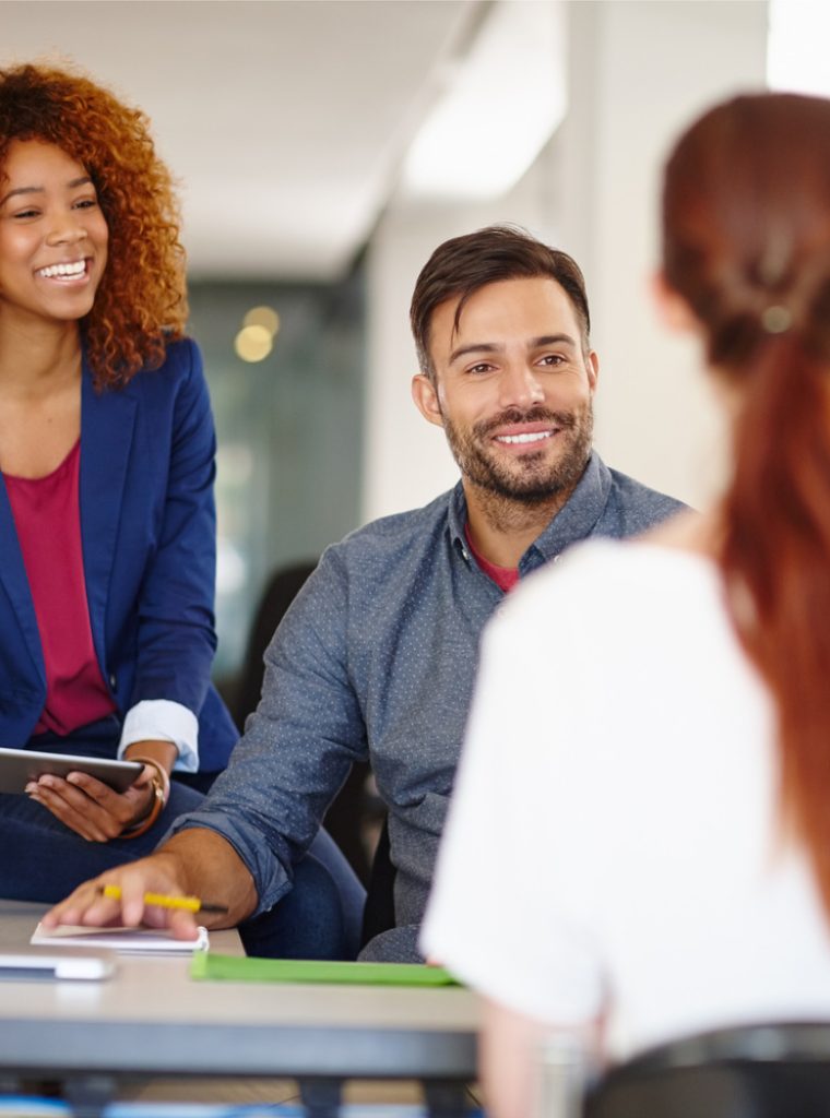 Cropped shot of a group of colleagues working together in an office.