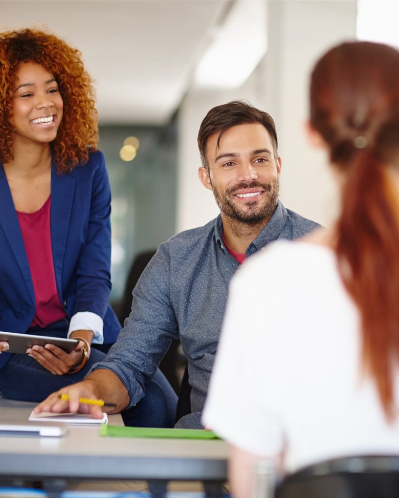 Cropped shot of a group of colleagues working together in an office.