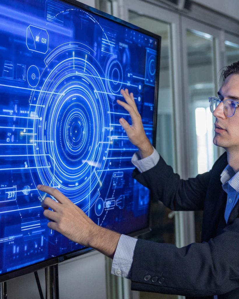 man-operating-futuristic-data-interface-on-touchsc-2026-03-27-01-33-03-utc (1) (1)